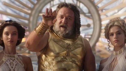 Russell Crowe as Zeus in Thor 4, with a young woman on each side of him.