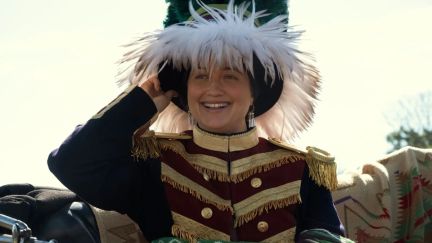 Mollie (played by Lily Gladstone) wearing a feather hat during her wedding in 'Killers of the Flower Moon.'
