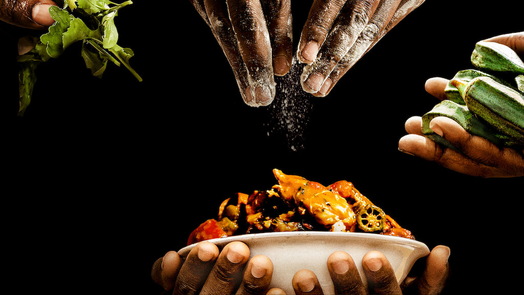 Hands cooking for the 'High on the Hog' promo poster.