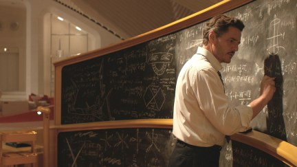 pedro pascal as reed richards writing on a chalk board